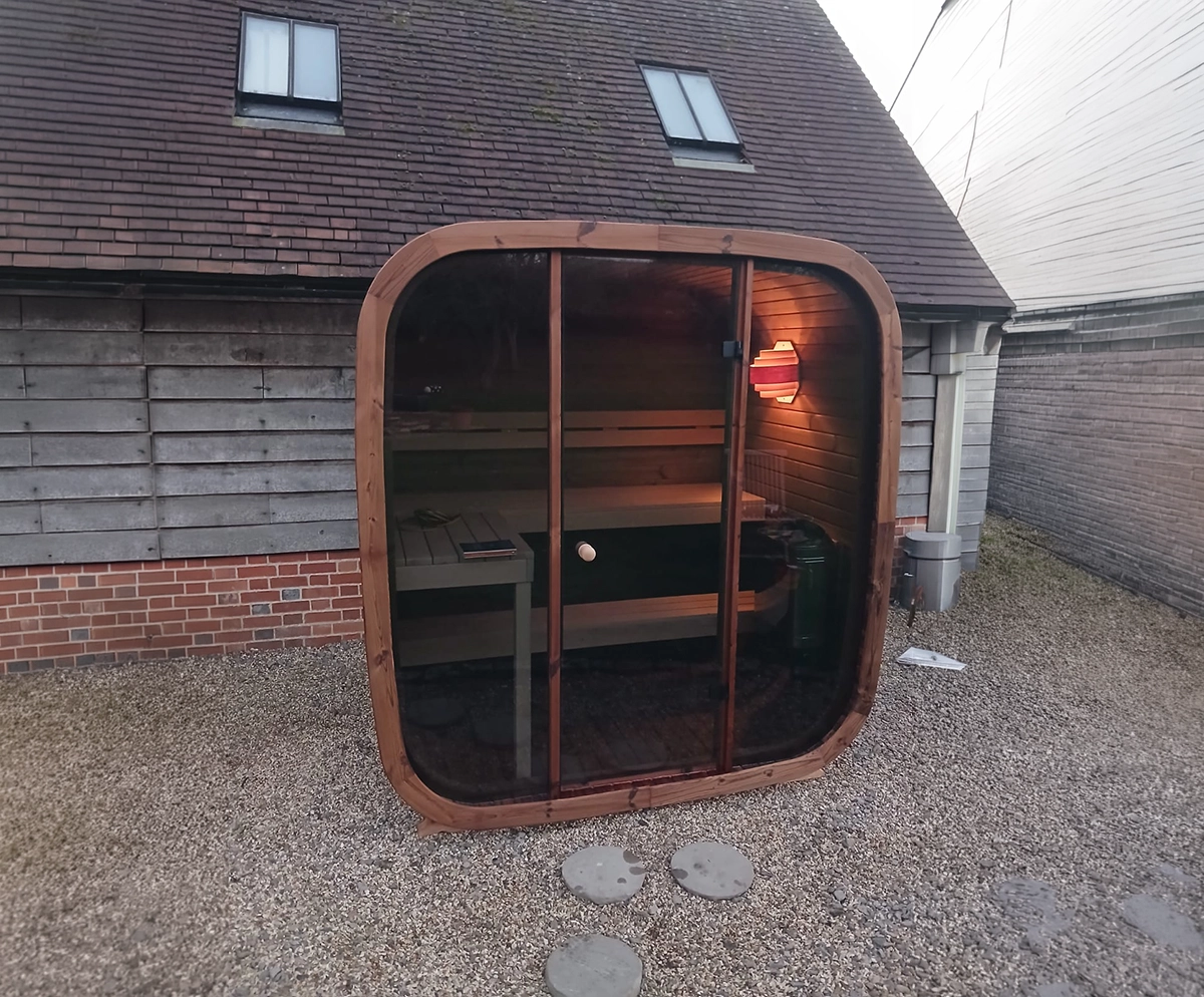 Luxury outdoor sauna cube design by GreenArt Landscapers Aberdeenshire